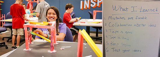 Participant smiling while making a structure