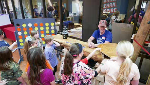 Children crowding around a table